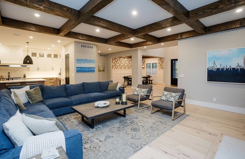 Grand Beach Haus | Heated pool, porch w/ fireplace, close to beach & park, 6 per golf cart included