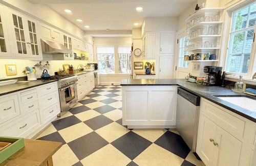 Northeast Harbor Hütte | Historic Summer Cottage with stunning views of the harbor and modern amenities.