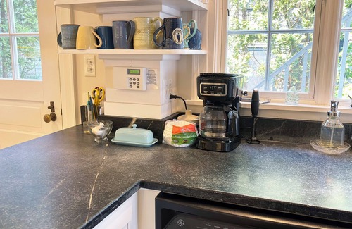 Northeast Harbor Hütte | Historic Summer Cottage with stunning views of the harbor and modern amenities.