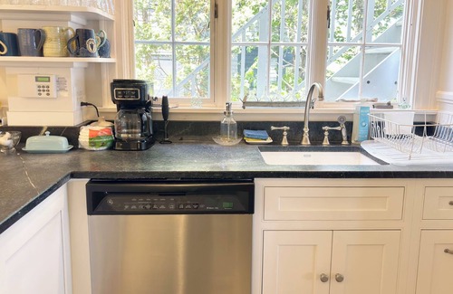 Northeast Harbor Hütte | Historic Summer Cottage with stunning views of the harbor and modern amenities.