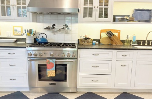 Northeast Harbor Hütte | Historic Summer Cottage with stunning views of the harbor and modern amenities.