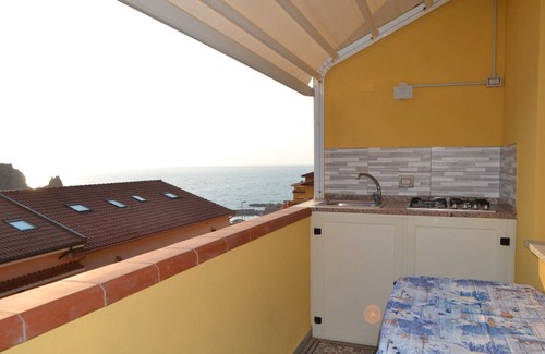 Buggerru Haus | Holiday Home 'Sole E Mare Buggerru - Appartamento' with Sea View, Private Terrace and Air Conditioning