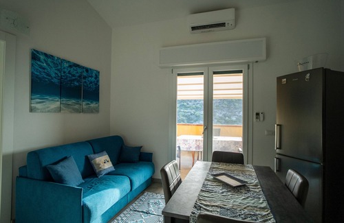 Buggerru Haus | Holiday Home 'Sole E Mare Buggerru - Appartamento' with Sea View, Private Terrace and Air Conditioning