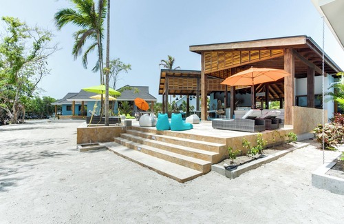 Placencia Haus | Hummingbird: Beachfront Cabana with Private Veranda on Belize Private Island