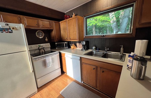 Kewadin Haus | Imogene's- Torch Lake cottage, waterfront w/ dock