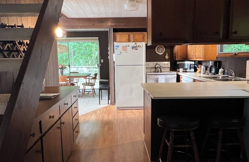 Kewadin Haus | Imogene's- Torch Lake cottage, waterfront w/ dock