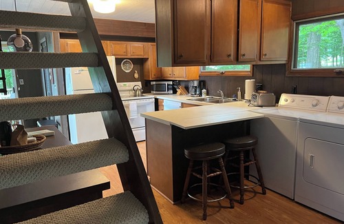 Kewadin Haus | Imogene's- Torch Lake cottage, waterfront w/ dock