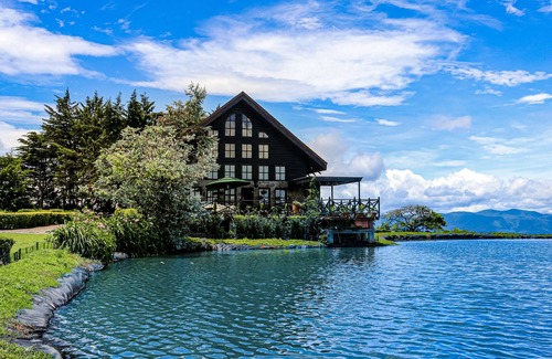 San Rafael Haus | Inviting dog-friendly home with lake, hot tub, game room, fireplace, & W/D