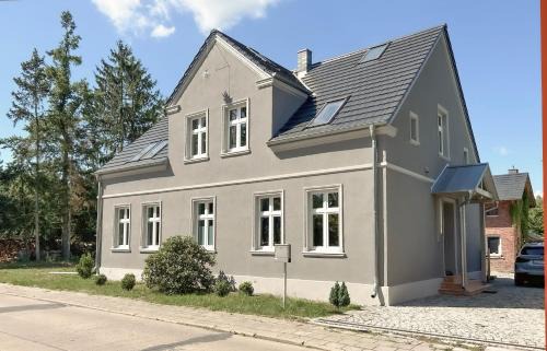 Hintersee Wohnung | Landhaus hinter`m See Ferienwohnung Landliebe luxuriöser Wintergarten Kachelöfen