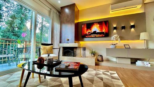 Carniel Wohnung | Lindo e aconchegante com lareira cond c/piscina