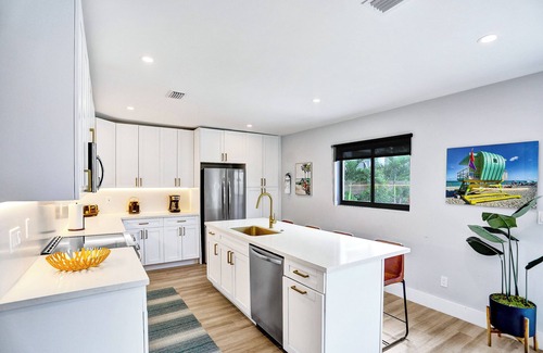 Lake Ridge Haus | Modern coastal luxury vacation rental with heated pool minutes to Central Beach