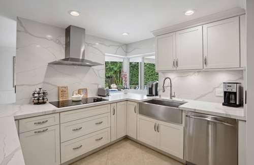 Tropic Isle Haus | Spanish Trail Waterfront Oasis - Luxurious Single Story Home in Delray Beach!