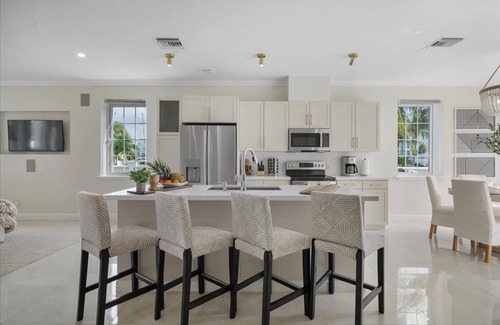 Palm Cay Haus | Luxury Beach side escape, steps from private beach, restaurant, marina, and café