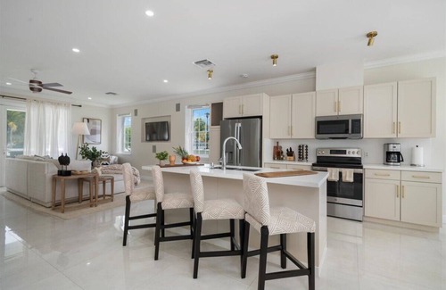 Palm Cay Haus | Luxury Beach side escape, steps from private beach, restaurant, marina, and café
