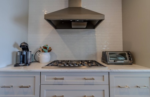 Suttons Bay Haus | Luxury Lakefront Retreat with Private Beach & Hot Tub