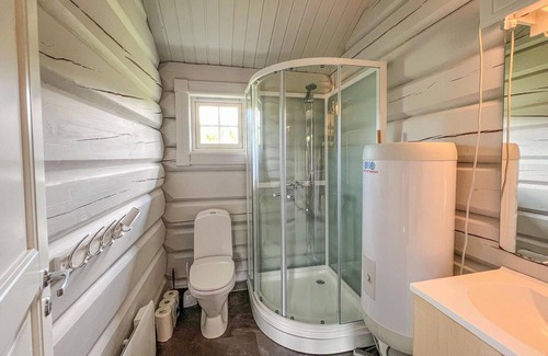 Nord-Torpa Haus | Make yourself comfortable in this open-plan log cabin with a wonderful view of the countryside.