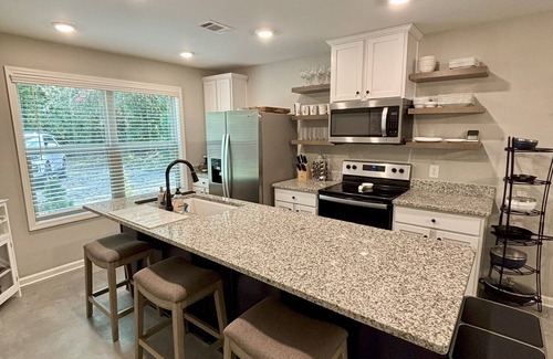 Rabun Gap Haus | Modern, 3/2 bed with fireplace, screened porch, & outdoor seating area.