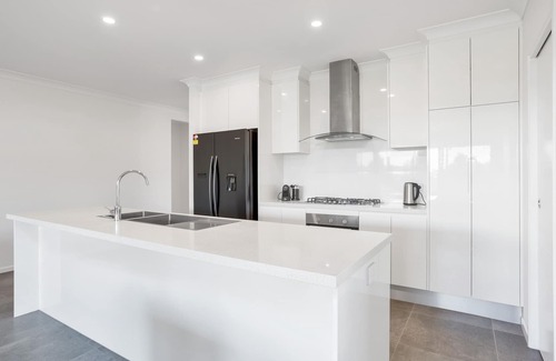 Trinity Beach Haus | Modern Home with Private Spa and Fenced Garden