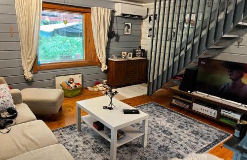 Etelainen Haus | Mökkituulos, beds for 4 One big bedroom, two beds separated with a big wardrobe