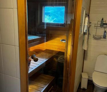 Etelainen Haus | Mökkituulos, beds for 4 One big bedroom, two beds separated with a big wardrobe