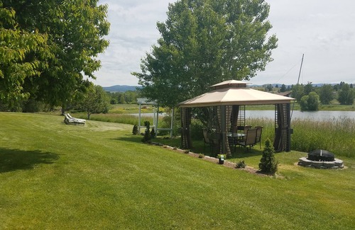 Florence Haus | Montana Mountain Memories- RV in Orchard by Trout Pond