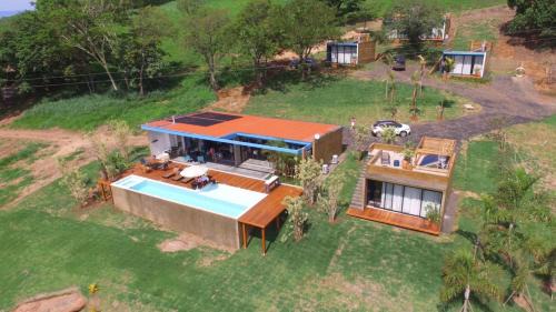 Cassia Haus | @morro.redondo - A casa Azul e seu Pôr do Sol