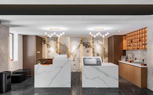 Xincheng District Hotel | Nashili Hotel