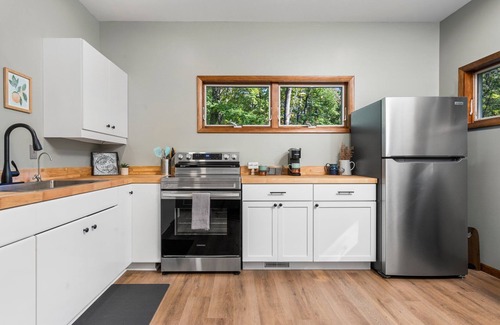 Big Rapids Haus | Nestled in the woods, this private detached Guest House is a perfect getaway!