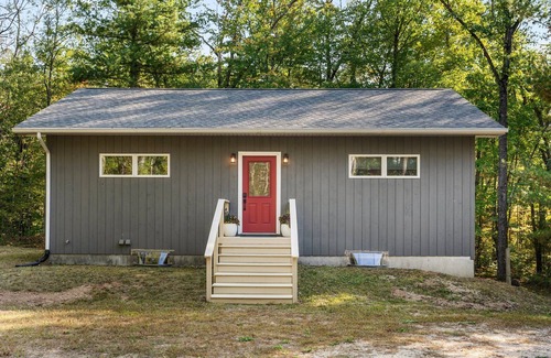 Big Rapids Haus | Nestled in the woods, this private detached Guest House is a perfect getaway!