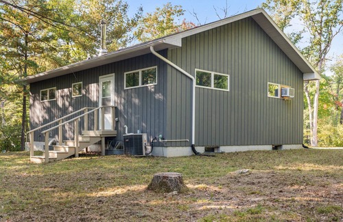 Big Rapids Haus | Nestled in the woods, this private detached Guest House is a perfect getaway!