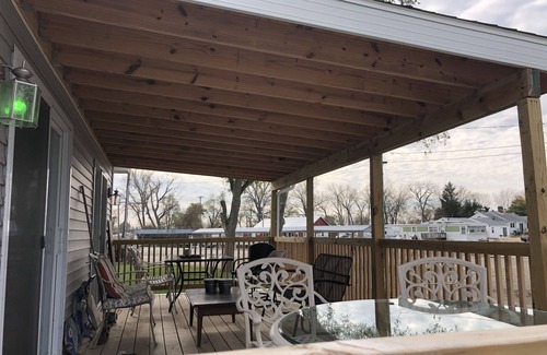 Oak Harbor Haus | New! 30 seconds from couch to shore, covered front porch w/sunset water views.