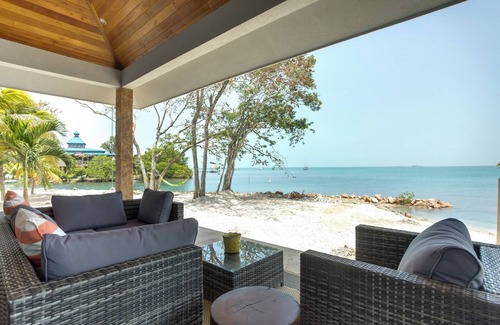 Placencia Haus | Oceanview Suite with King Bed, Lounge Space & Outdoor Rain Shower