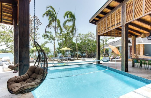 Placencia Haus | Oceanview Suite with King Bed, Lounge Space & Outdoor Rain Shower