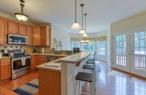 Livingston Haus | Peaceful lakeside retreat with hot tub, private pool, dock & paddle boards