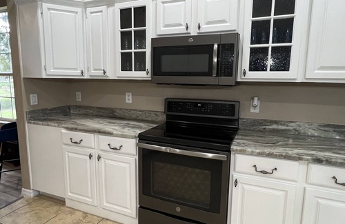 Eustis Haus | Prepared to be impressed! Welcome home! 7 bedroom 4 bathroom with HEATED pool!