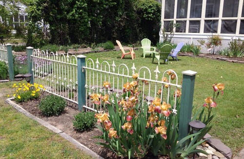 Cape May Point Haus | Pristine, Cozy, 4 bedroom Beach Cottage with a 40 foot screened in front porch!