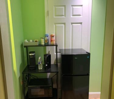 Pinellas Park Haus | Private suite with small kitchen private bathroom entrance porch and driveway