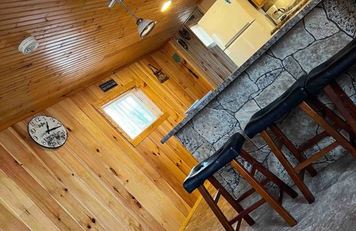 Manitou Beach Haus | Remodeled cozy retreat with a lake front view on Devils Lake. Pet Friendly!
