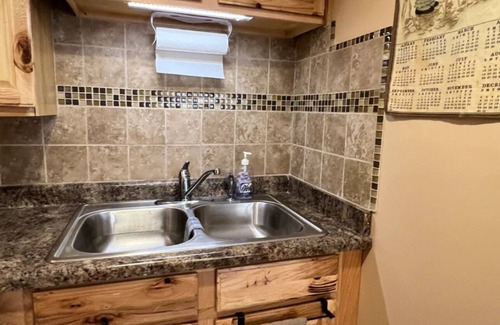 Manitou Beach Haus | Remodeled cozy retreat with a lake front view on Devils Lake. Pet Friendly!