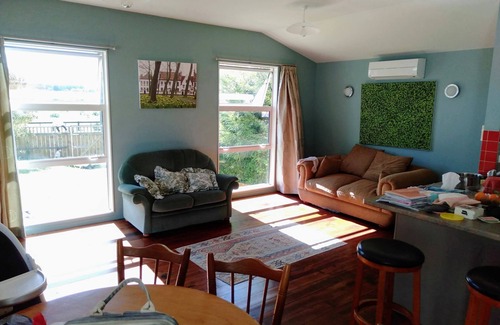 Waitarere Beach Haus | Renovated oasis with large deck and leafy privacy