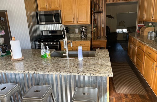 Navajo Dam Haus | River front fishing house close to Quality Waters and Navajo State Park