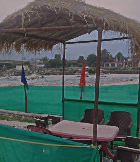 Shamshi Haus | River side cafe guest cottage