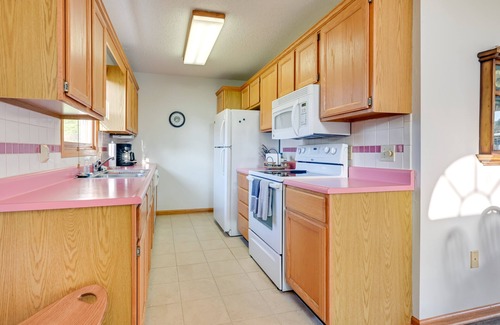 Au Gres Hütte | Riverfront Au Gres Cottage w/ Fire Pit & Grill!