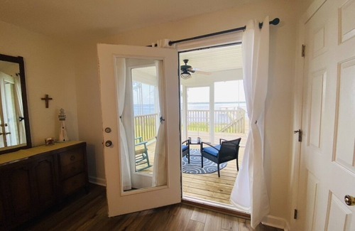 Hobucken Haus | Riverfront property with dock and ramp. Dolphins, fish, boat, swim & more