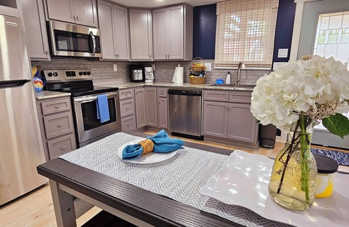 Carrabelle Haus | Riverfront Retreat- Fishing Dock, Screen Porch, Shaded Lawn, Adirondack Chairs