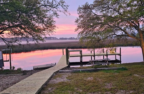 Carrabelle Haus | Riverfront Retreat- Fishing Dock, Screen Porch, Shaded Lawn, Adirondack Chairs