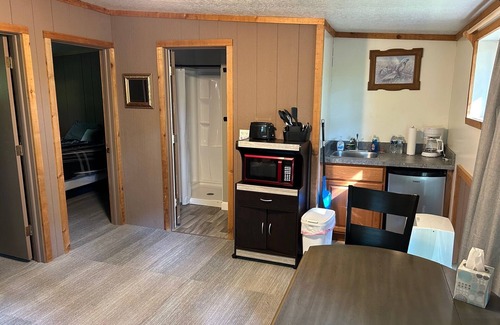 Palmyra Hütte | Rustic cabins in secluded campground with lake access and woods to wander in.