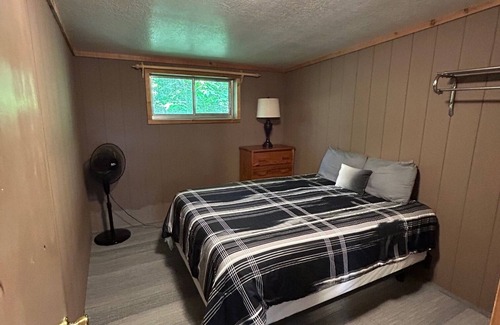 Palmyra Hütte | Rustic cabins in secluded campground with lake access and woods to wander in.