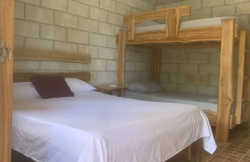 Marbella Kabine | Rustic jungle lodge in a tranquil garden setting - Room 6 Family room