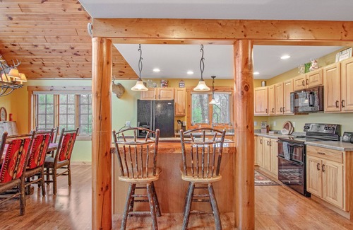 Necedah Haus | Rustic, spacious, lakefront home with private boat slip, game room & gazeebo